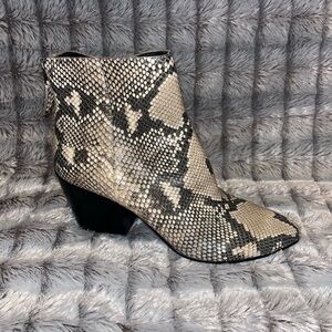 Women’s 8 Dolce Vita Snake print booties.